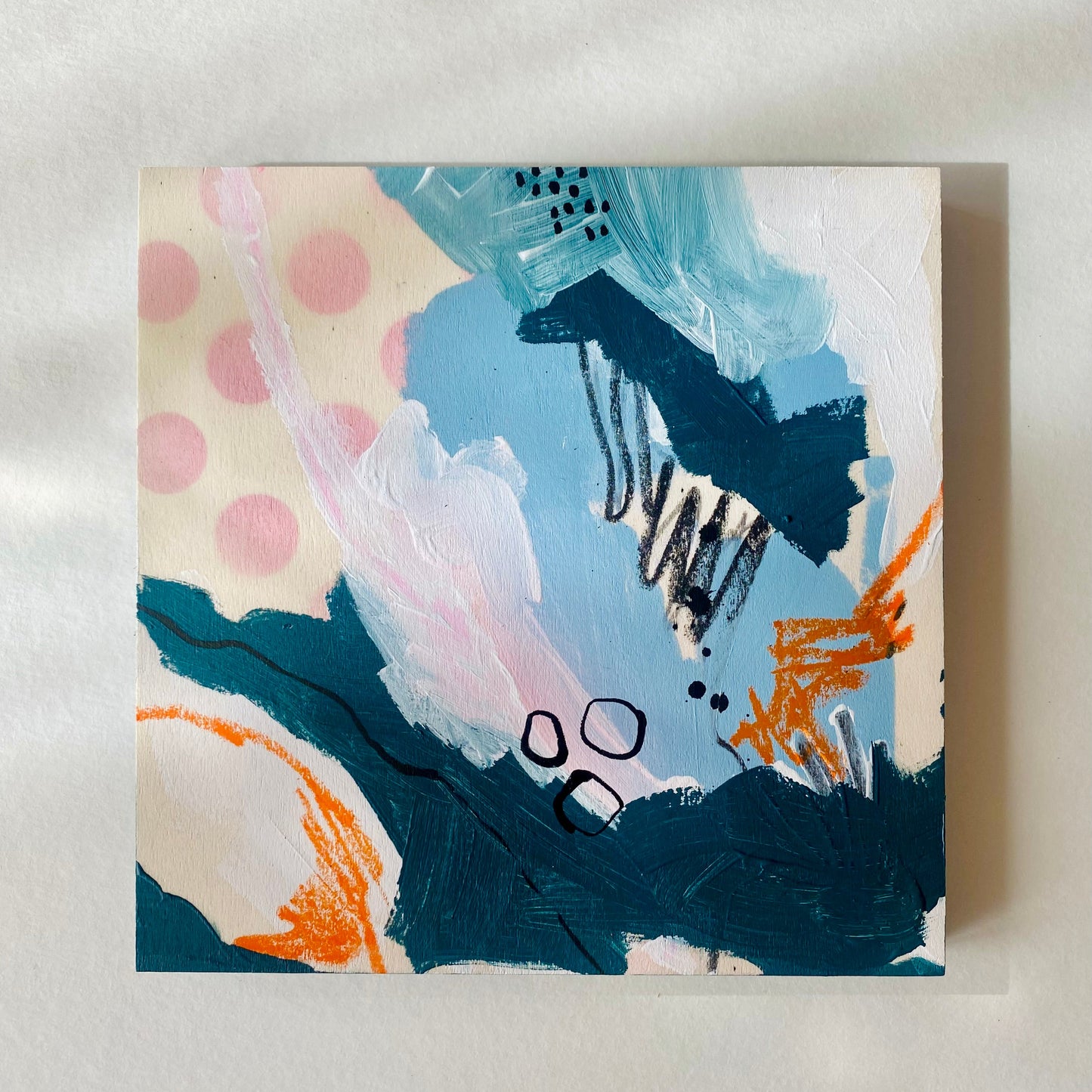 Abstract painting with colorful brush strokes on a light background
